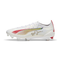 PUMA Ultra 5 Ultimate Senna Gazon Naturel Chaussures de Foot (FG) Blanc Doré Rouge